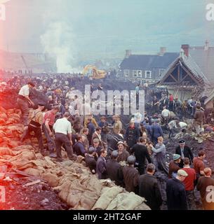 The Disaster scene at Aberfan, South Wales. At 9.15 am on Friday 21 October 1966, after days of rain, a mining waste tip slid down a mountainside into the village of Aberfan, near Merthyr Tydfil in South Wales. It first destroyed a farm cottage in its path, killing all the occupants, before engulfing 20 houses and Pantglas Junior School where pupils had just returned to class after singing 'All Things Bright and Beautiful' at assembly. The toll was 144 dead, 116 of them children   Picture taken by Carl Bruin   Picture taken circa 21st October 1966The events of Friday, 21 October 1966 Tip no. 7 Stock Photo