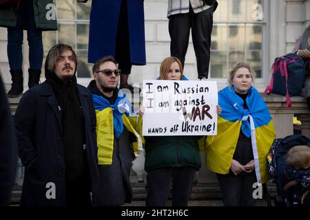 London, UK. 26th Feb, 2022. Protesters hold placards during the demonstration.More than thousands of Ukrainians and their supporters in London continued to gather to protest outside Downing Street as the Ukrainian crisis continues. The organisers said they are planning to protest outside the Downing Street everyday to stand in solidarity with the people in Ukraine. Credit: SOPA Images Limited/Alamy Live News Stock Photo