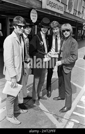 British rock group The Yardbirds at London airport as they leave for Canada to start a month long tour of the United States. They are: Jim McCarty, Jeff Beck, Jimmy Page wearing a bus ticket punch, Chris Dreja and Keith Relf. 4th August 1966. Stock Photo