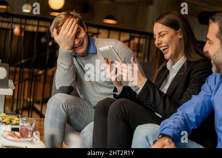 Four business people are organizing and making the project for the company Stock Photo