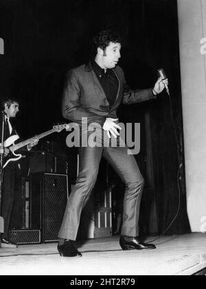 Tom Jones during a concert in aid of the Aberfan Fund, which was held at Sophia Gardens Pavillion, Cardiff, last night.December 1966.  The events of Friday, 21 October 1966 Tip no. 7, which was 500 feet above the village of Aberfan, near Merthyr Tydfil, started to slide at 9.15 am. It was the last day before half-term at the Pantglas schools below.  It first hit a farm, killing everybody in it. Then it engulfed Pantglas Junior School, killing 109 children and five teachers. Only a handful of the children aged between seven and ten survived. The tip comprised colliery waste, liquefied by the sp Stock Photo