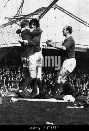 Wolves 2-4 Manchester United, FA Cup Fifth Round match at Molineux, Denis Law is congratulated on his goal by jubilant teammates George Best (centre) and Bobby Charlton, Saturday 5th March 1966. Stock Photo