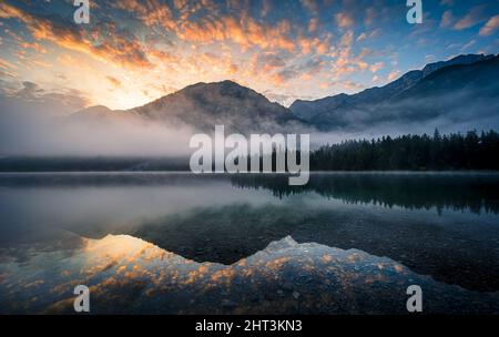 Scenic view of the Lake Plansee during sunrise Stock Photo