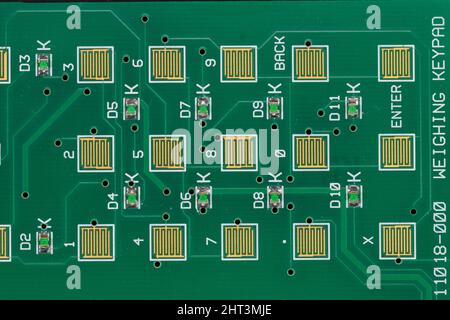 Close up of a printed circuit board of the keyboard from a small dedicated computer unit used on industrial weighing equipment Stock Photo