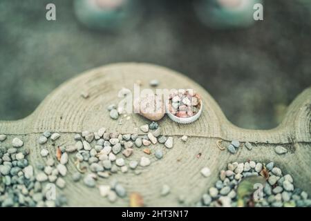 A closeup shot of colorful pebbles on the decorative stone board  on a blurred background Stock Photo