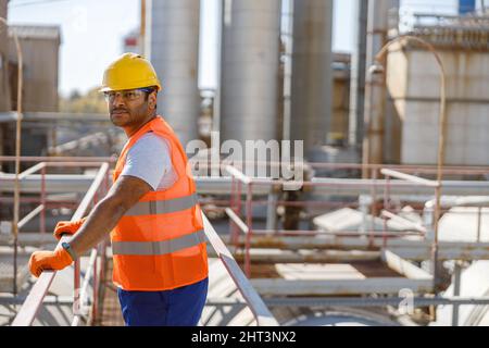 Experienced worker concentrating at his work in plant Stock Photo
