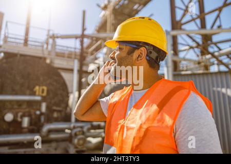 Construction engineer with using cellphone at plant Stock Photo