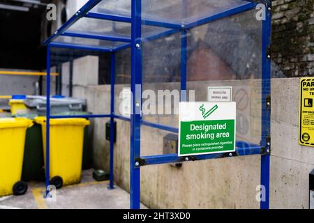 Covered smoking area outside work place, designated area protected from weather to smoke tobacco Stock Photo