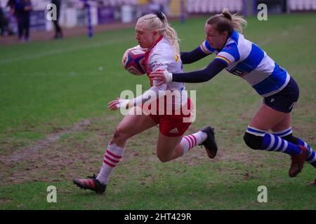 Darlington, England, 26 February 2022. Amy Layzell of DMP Durham Sharks attempting to stop Heather Cowell of Harlequins Women scoring a try during their Premier 15s match at Darlington Arena. Credit: Colin Edwards Stock Photo