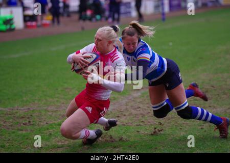 Darlington, England, 26 February 2022. Amy Layzell of DMP Durham Sharks attempting to stop Heather Cowell of Harlequins Women scoring a try during their Premier 15s match at Darlington Arena. Credit: Colin Edwards Stock Photo