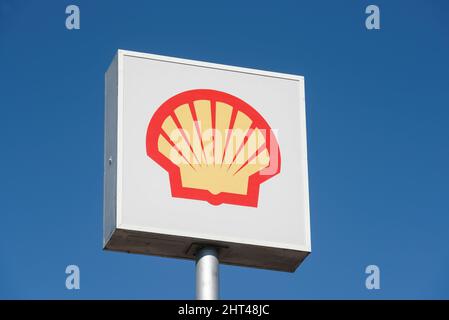 Conway, WA, USA - February 25, 2022; Elevated sign for a Shell Plc gas station isolated against a blue sky Stock Photo