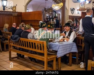 View of People drinking beer in Hofbraeuhaus beer house, Munich, Bavaria, Germany Stock Photo