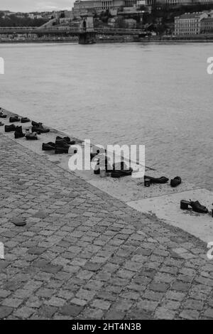 Grayscale shot of the Shoes on the Danube Bank memorial Stock Photo