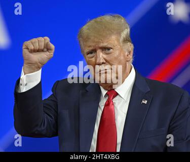 President Donald Trump pumps his fist while walking to Air Force One at ...