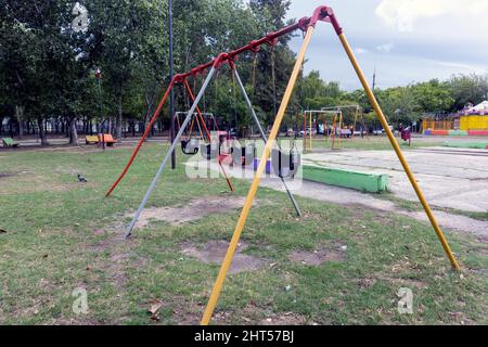 park with empty children's swings Buenos Aires (Argentina) Stock Photo