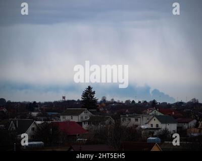 Kiev, Ukraine - February 27, 2020: Smoke from a fire at an oil depot in the city of Vasilkiv is clearly visible in Boryspil at a distance of about 40 km. Russian troops launched a missile attack on an oil depot on the outskirts of Vasilkiv. Due to the ongoing shelling, the firefighters were not able to start extinguishing the fire. Stock Photo