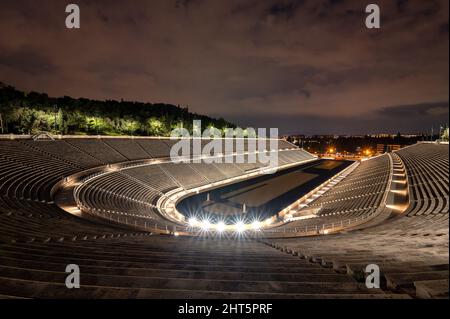 Illuminated Panathinaic stadium in Athens, Greece at dusk Stock Photo