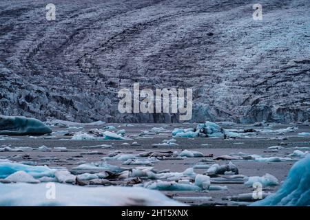 Spectacular glacier tongue end over icebergs lake Stock Photo