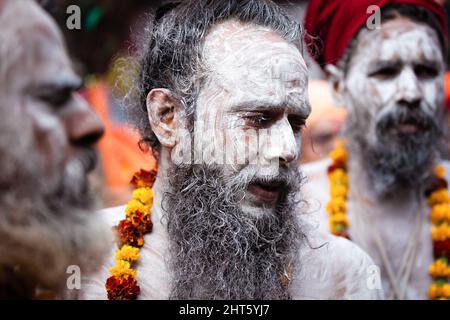 Kathmandu, Nepal. 27th Feb, 2022. Hindu holy men or Naga sadhu, with ashes on there bodies seen at the premises of the Pashupatinath Temple ahead of the Shivaratri festival in Kathmandu. Hindu Devotees from Nepal and India come to this temple to take part in the Shivaratri festival which is one of the biggest Hindu festivals dedicated to Lord Shiva and celebrated by devotees all over the world. Credit: SOPA Images Limited/Alamy Live News Stock Photo