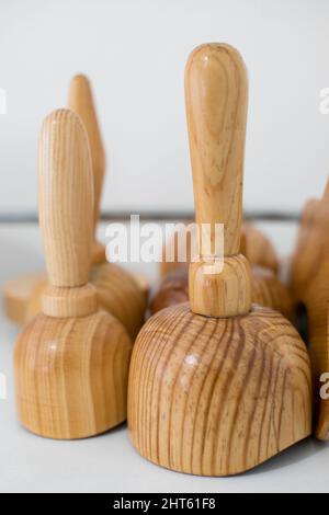 A vertical shot of wooden massage supplies. Stock Photo