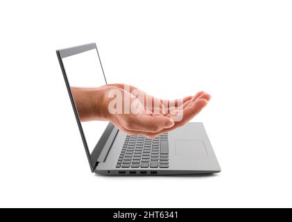 Open hand out of a laptop screen isolated on white. Holding, giving, showing concept. Stock Photo