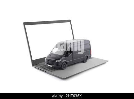 Black cargo delivery truck on laptop isolated on white background Stock Photo