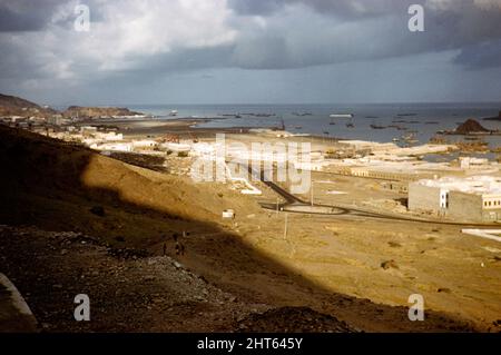 View over port facilities and shipping in harbour, Aden, Yemen, 1956 Stock Photo