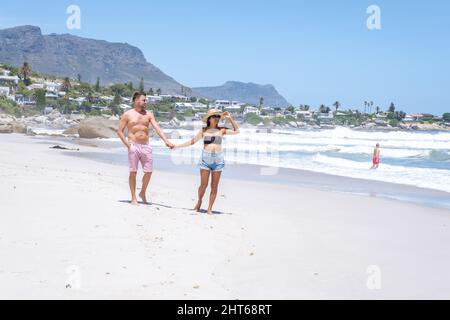 Clifton beach Cape Town South Africa, white sandy beach in Cape Town Clifton. Couple man and woman on the beach Stock Photo