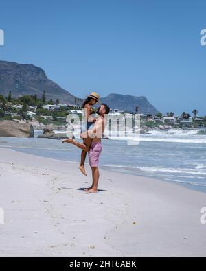 Clifton beach Cape Town South Africa, white sandy beach in Cape Town Clifton. Couple man and woman on the beach Stock Photo