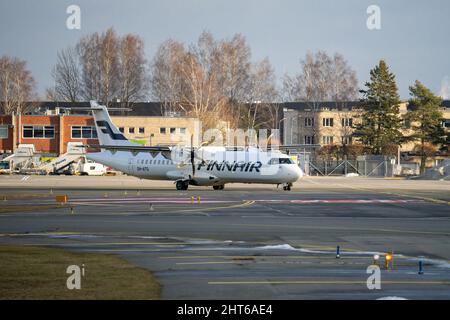 15-01-2022 Riga, Latvia White Passenger plane fly up over take-off runway from airport Stock Photo