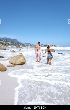 Clifton beach Cape Town South Africa, white sandy beach in Cape Town Clifton. Couple man and woman on the beach Stock Photo