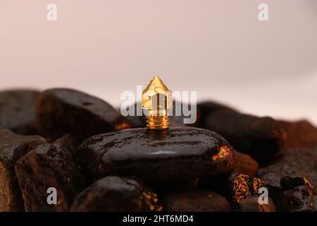 3D printer brass nozzle on a wet stone, Spare parts for 3d printer machine Stock Photo