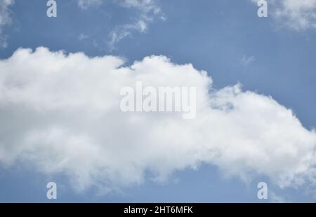 cloud spreading on bright sky in sunny day Stock Photo