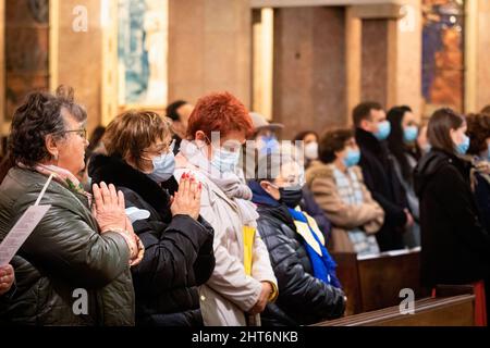Ukrainian women take part during the vigil. A joint vigil for the Ukrainian people took place in Senhora da Conceição Church in the Marquês Square, in Porto, organized by the Ukrainian Orthodox Parish of Saint Panthaleon and the Catholic Parish of Senhora da Conceição. Stock Photo
