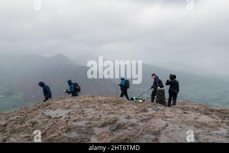 Catbells summit walk on a wet, rainy and windy day, Lake District, Cumbria, England, UK Stock Photo