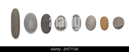 Collection of stones. Various types of pebbles with a soft shadow on a white background. Stock Photo