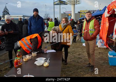 Przemysl, Poland. 26th Feb, 2022. A staff member registers information for people from Ukraine in Przemysl, Poland, Feb. 26, 2022. Credit: Meng Dingbo/Xinhua/Alamy Live News Stock Photo