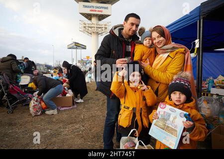 Przemysl, Poland. 26th Feb, 2022. A family from Ukraine pose for a photo in Przemysl, Poland, Feb. 26, 2022. Credit: Meng Dingbo/Xinhua/Alamy Live News Stock Photo