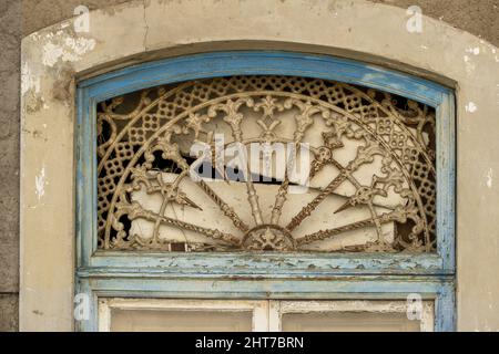 cast iron decoration above an entrance door to an old house in Portimao, Algarve, Portugal Stock Photo