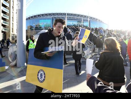 London, UK. 27th Feb, 2022. Fans with Ukrainian flags are seen outside the stadium prior to the Carabao Cup match at Wembley Stadium, London. Picture credit should read: Paul Terry/Sportimage Credit: Sportimage/Alamy Live News Credit: Sportimage/Alamy Live News Stock Photo