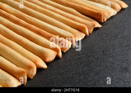 Thin breadsticks called Grissini Torinesi. Shallow depth of field. Stock Photo