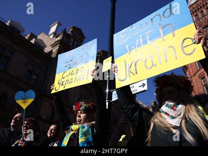 Nottingham, Nottinghamshire, UK. 27th February 2022. Demonstrators attend a vigil after Russian President Vladimir Putin ordered the invasion of Ukraine. Hundreds of people gathered in Old Market Square to show support to Ukrainian people. Credit Darren Staples/Alamy Live News. Stock Photo