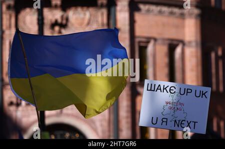 Nottingham, Nottinghamshire, UK. 27th Feb, 2022. Demonstrators attend a vigil after Russian President Vladimir Putin ordered the invasion of Ukraine. Hundreds of people gathered in Old Market Square to show support to Ukrainian people. Credit: Darren Staples/Alamy Live News Stock Photo