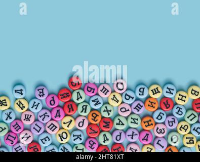 Cyrillic letters colorful buttons on a pastel blue background. Russia, Eastern Europe conceptual backdrop. Stock Photo