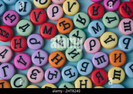 Cyrillic letters colorful buttons on a pastel background. Russia, Eastern Europe conceptual backdrop. Stock Photo