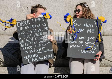 Trafalgar Square, London, UK. 27th Feb, 2022. Several thousand people assemble in Trafalgar Square for the 'Stand with Ukraine' rally, to protest against the Russian invasion of Ukraine and for peace with placard, banners and flags. Credit: Imageplotter/Alamy Live News Stock Photo