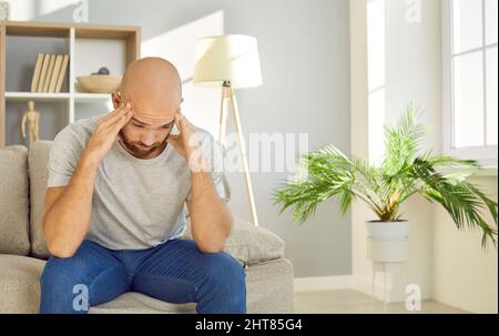 Unhealthy man feel sick suffer from headache Stock Photo