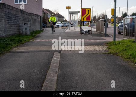The transition between a shared use pavement and segregated cycleway and footway on a suburban road in South Gloucestershire. Stock Photo