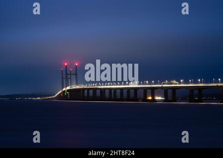 The M4 Second Severn Crossing bridge is lit at night on the Severn Estuary. Stock Photo