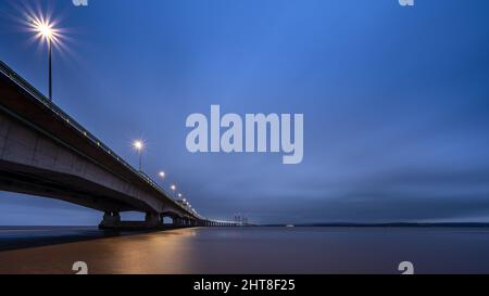 The M4 Second Severn Crossing bridge is lit at night on the Severn Estuary. Stock Photo